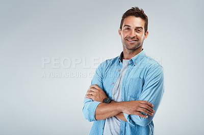 Buy stock photo Portrait, space and happy man with arms crossed, fashion or trendy outfit for confidence on grey background. Model, mockup or creative male designer with proud smile, modern clothes or style to relax