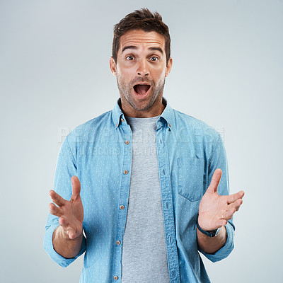 Buy stock photo Portrait of a surprised facial expression standing against a grey background