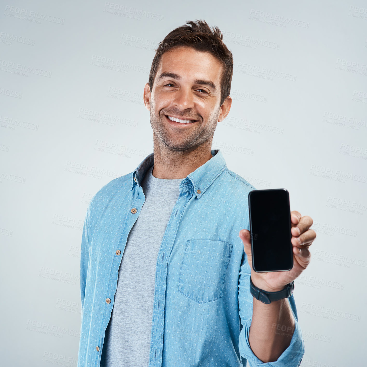 Buy stock photo Advertising, phone screen and portrait with smile of man in studio on white background for communication. App, casual and social media marketing with happy person showing mobile display for mockup