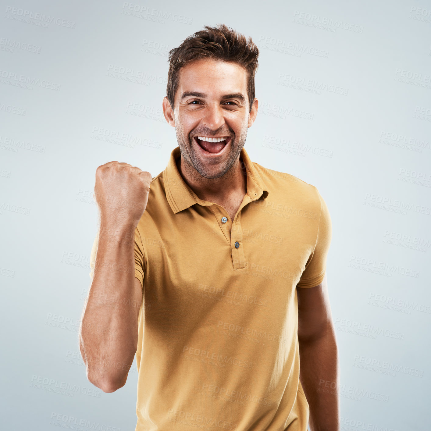 Buy stock photo Achievement, smile and winner with portrait of man in studio on white background for discount or success. Celebration, fist and motivation with happy person cheering yes for bonus, goal or target