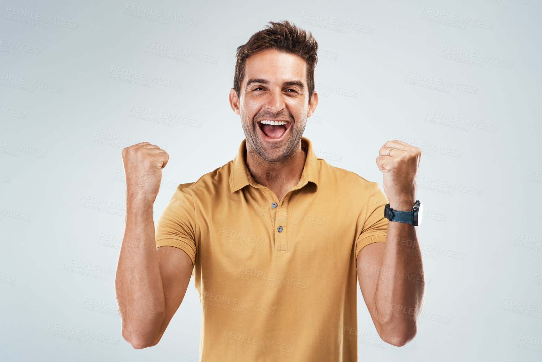 Buy stock photo Fist pump, smile and winner with portrait of man in studio on white background for bonus or success. Achievement, celebration and fist with happy person cheering yes for discount, goal or target