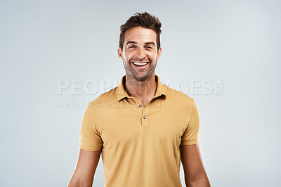 Buy stock photo Man, portrait and happy in studio mockup for good news, excited and positive energy. Person, laugh and confident on white background space for joke, humor or comedy storytelling in casual fashion