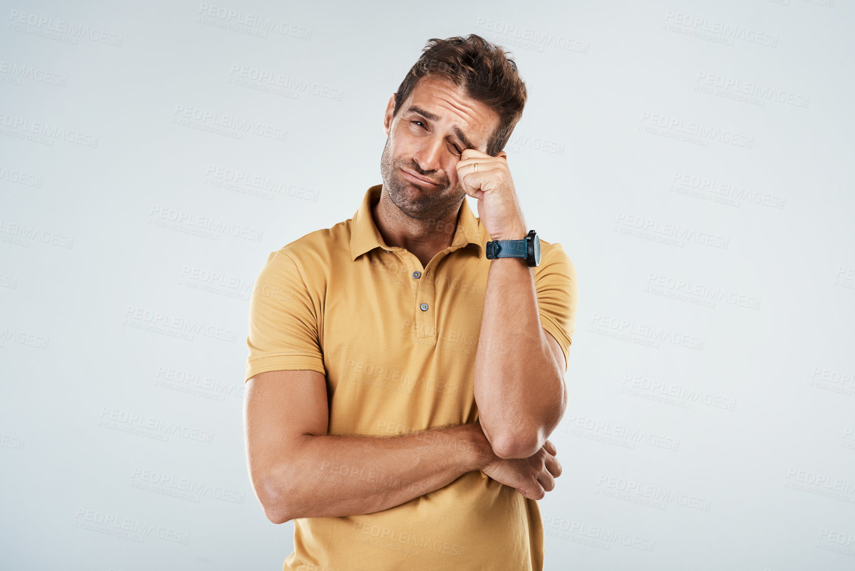 Buy stock photo Sad, portrait and man crying in studio for offense, upset and scared face expression for depression. Unhappy, grief and male person with tears for mental health, anxiety or fear by white background.