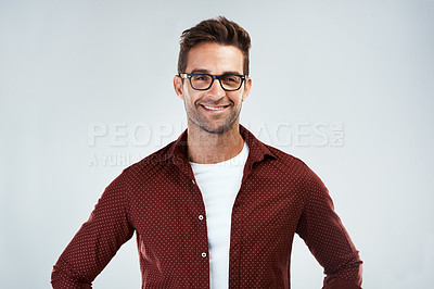 Buy stock photo Portrait, glasses and happy man with fashion, trendy or casual outfit for confidence on white background. Model, positive designer or creative person in studio with eyewear, modern clothes or style