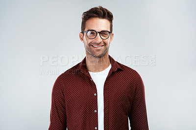 Buy stock photo Portrait, glasses and happy man with casual fashion or trendy outfit for confidence on white background. Model, positive designer or creative person in studio with eyewear, modern clothes or style