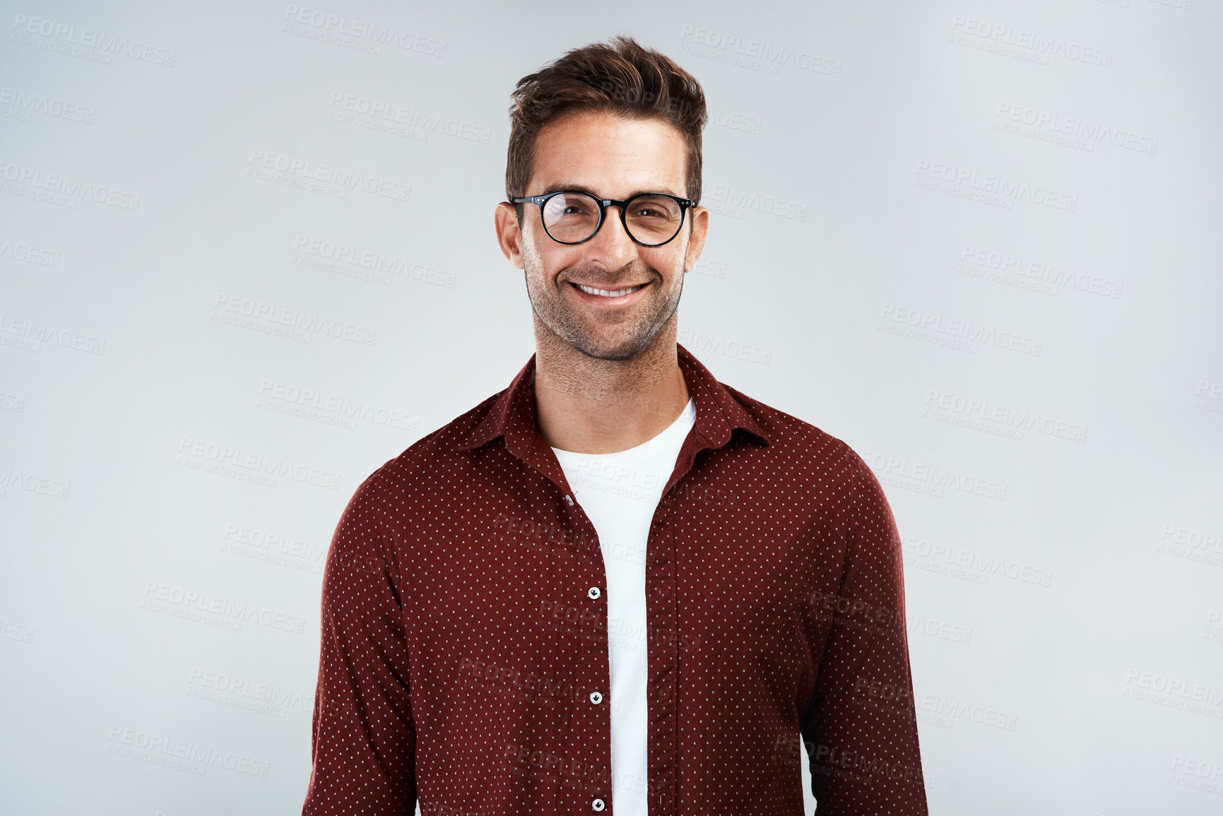 Buy stock photo Portrait, glasses and happy man with casual fashion or trendy outfit for confidence on white background. Model, positive designer or creative person in studio with eyewear, modern clothes or style