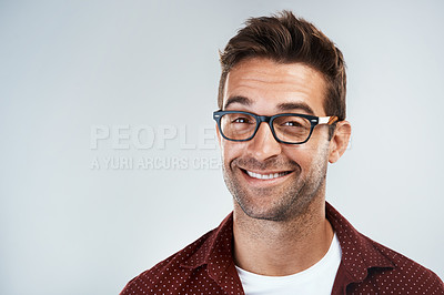 Buy stock photo Man, portrait and smile with eyeglasses in studio on white background with eyewear prescription for eyesight. Male person, happy and mockup space in confidence with frame for spectacles and vision