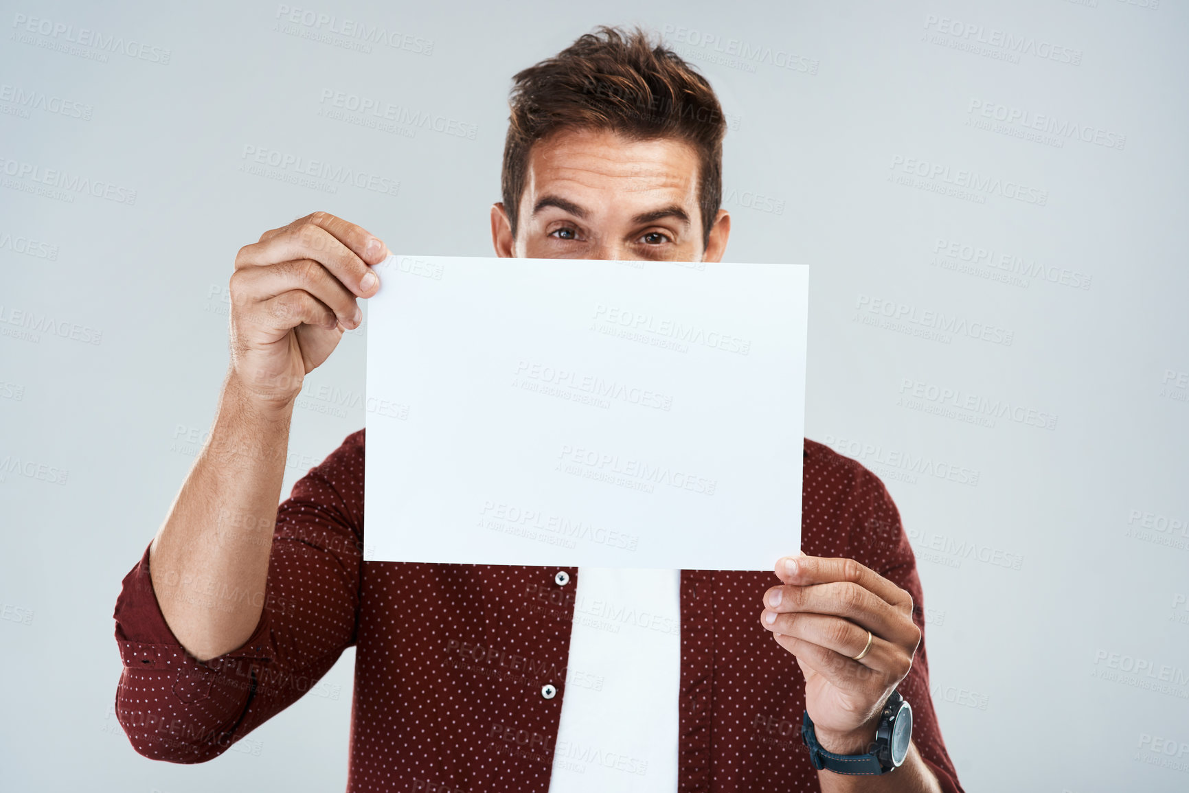 Buy stock photo Mockup, man and portrait with poster in studio for presenting ideas, creative pitch and advertising job opportunity. Male person, placard and white background with space for announcement and message.