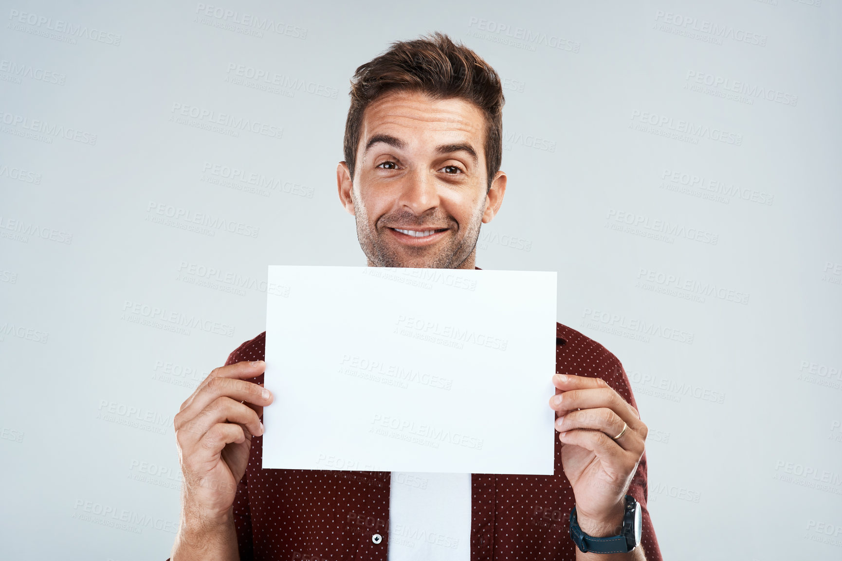 Buy stock photo Happy, man and portrait with poster mockup in studio for presenting idea, creative pitch and advertising job opportunity. Person, placard and white background with space for announcement and message.