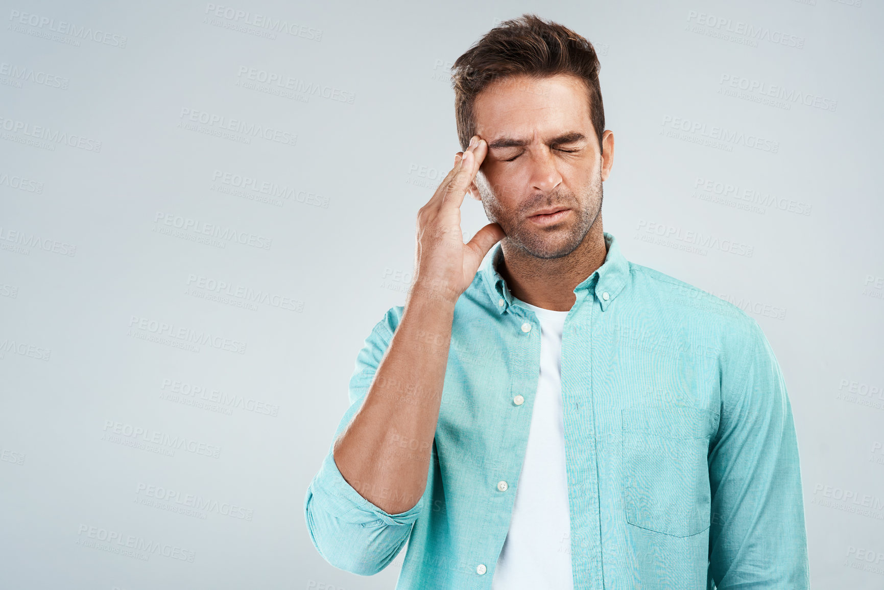 Buy stock photo Stress, pain and man with headache in studio for health risk, burnout and frustrated for brain fog. Guy, temple massage and migraine for debt crisis, financial problem and mistake by white background