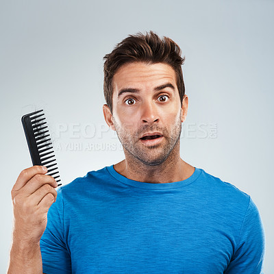 Buy stock photo Man, face and stress for hair loss comb with crisis, genetic disease and thyroid problem in studio. Guy, portrait and fear for alopecia with brush, testosterone issue and aging by white background