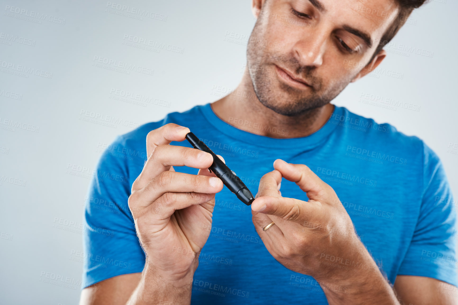 Buy stock photo Man, finger and check blood for diabetes with healthcare, wellness and monitor insulin in studio. Sick male person, hand and medical device for glucose analysis, results and care by white background