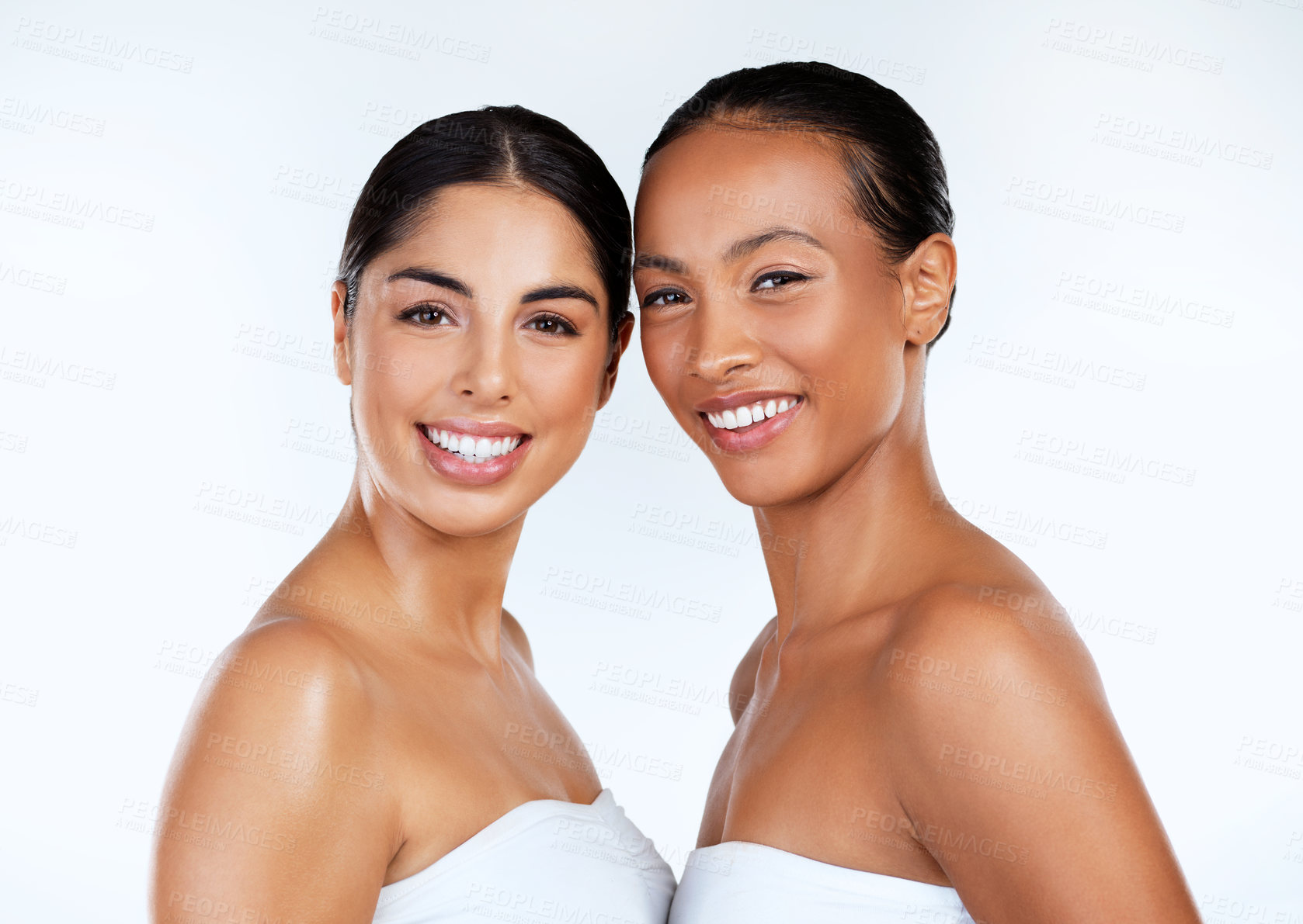 Buy stock photo Studio shot of beautiful young women posing against a grey background 