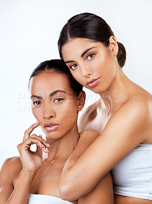 Buy stock photo Woman friends, studio portrait and cosmetics for self care, beauty or wellness by white background. Women, skincare and together for support, isolated or diversity with natural glow, face with makeup