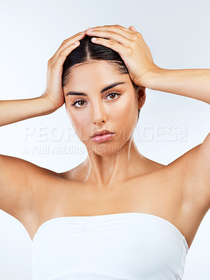 Buy stock photo Studio shot of beautiful young women posing against a grey background 