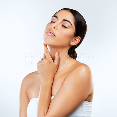 Buy stock photo Studio shot of beautiful young women posing against a grey background 