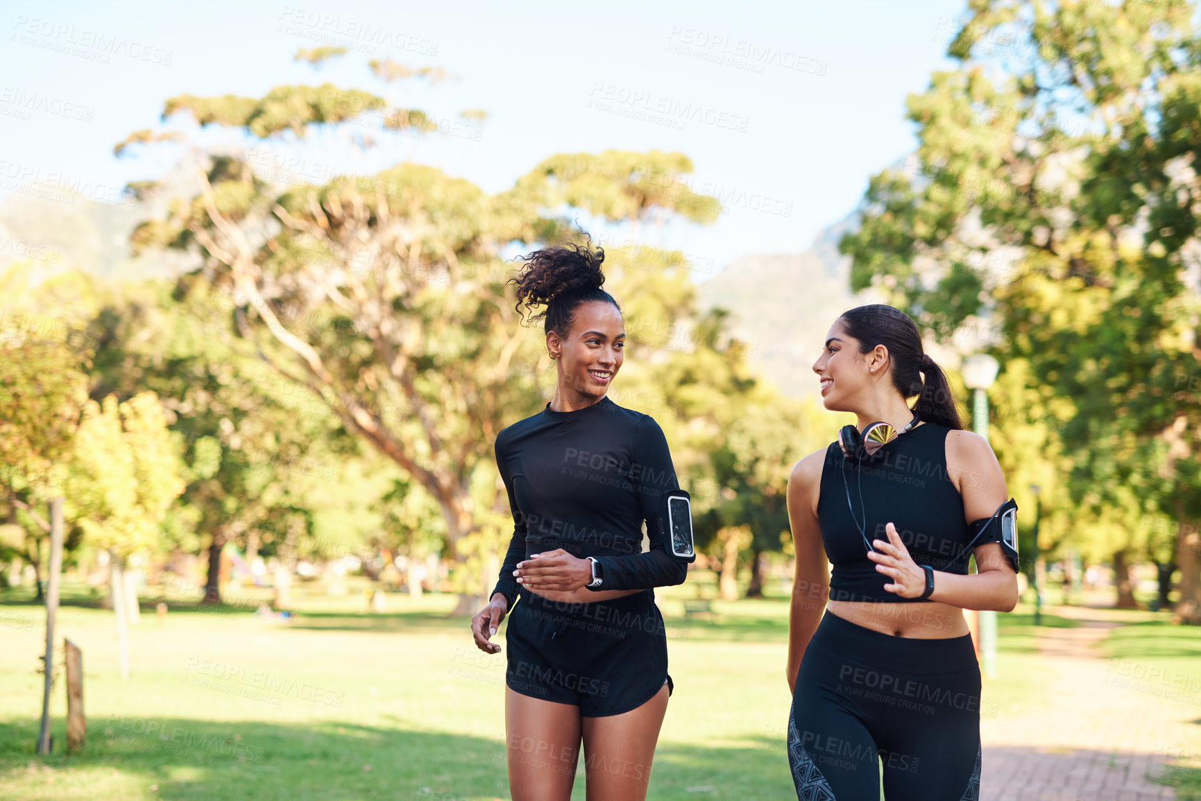 Buy stock photo Friends, women and fitness with running in park with happiness for workout and jogging in Atlanta. Bonding, runner and smile or confident with exercise for health, wellness and self care on race