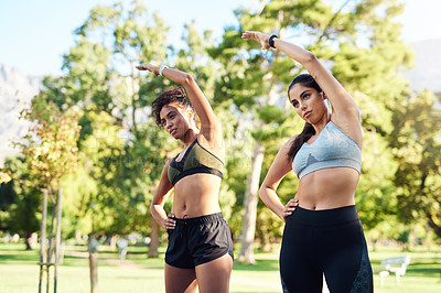 Buy stock photo Body, fitness and stretching with woman friends outdoor in park together for start of workout routine. Exercise, health and wellness with confident athlete people in summer for challenge or training