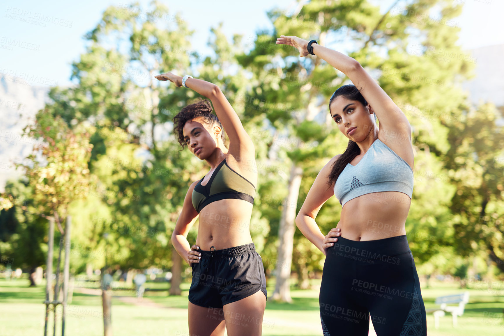 Buy stock photo Body, fitness and stretching with woman friends outdoor in park together for start of workout routine. Exercise, health and wellness with confident athlete people in summer for challenge or training