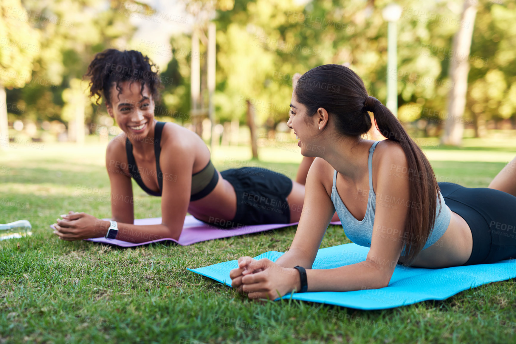 Buy stock photo Fitness, smile and yoga with women in park together for outdoor bonding, health or wellness. Conversation, exercise and performance with happy friends on grass for balance, challenge or strength