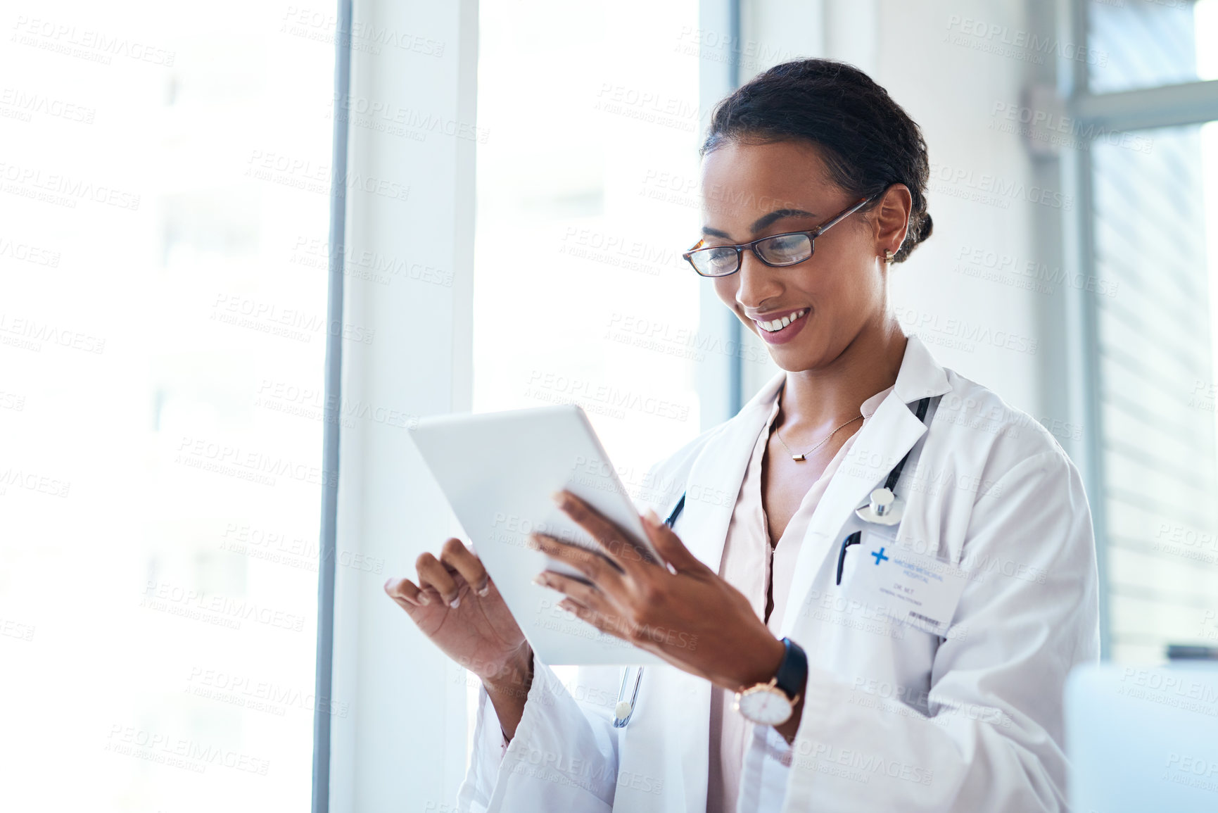 Buy stock photo Doctor, tablet and happy woman reading for research, info and healthcare update in hospital. Digital technology, medical professional and check schedule, report or results for telehealth on internet