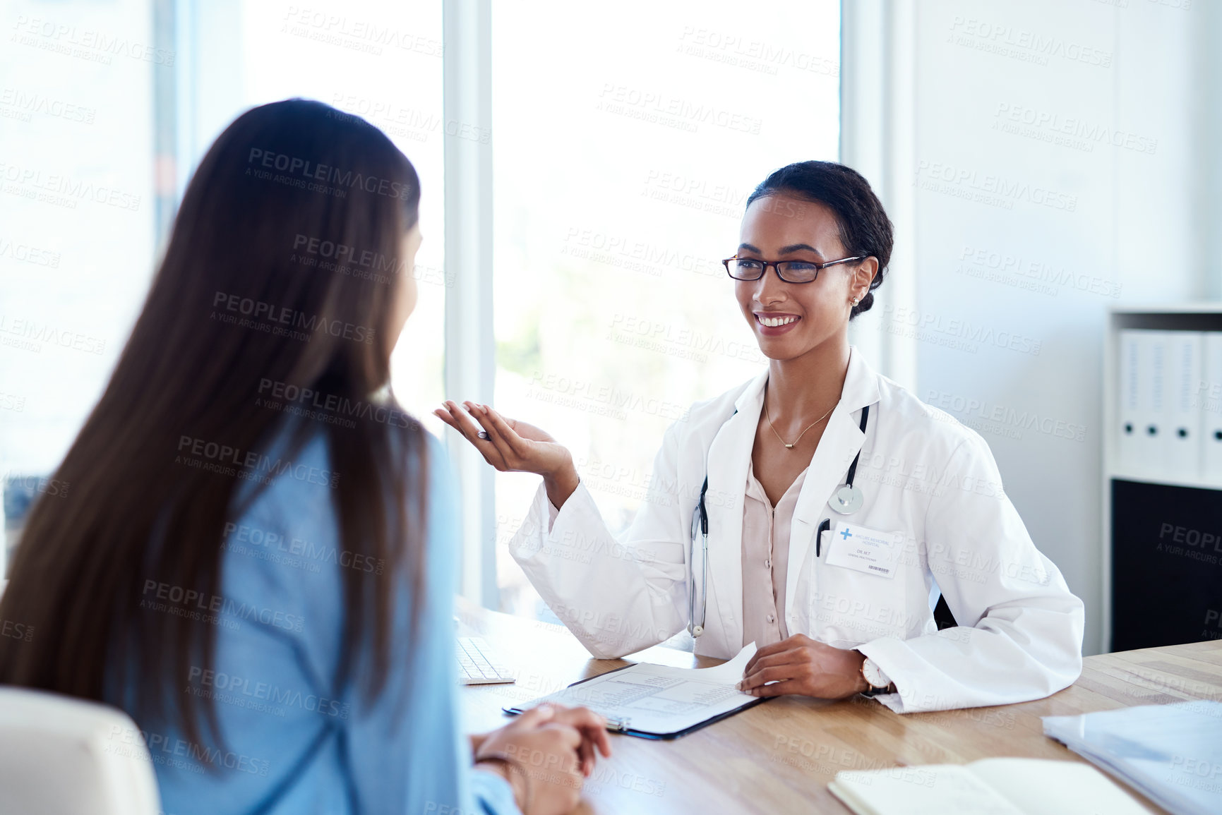 Buy stock photo Hospital, talking and doctor with patient for consulting, medical service and diagnosis in clinic. Healthcare, discussion and person with woman with forms for medicine, wellness and health insurance