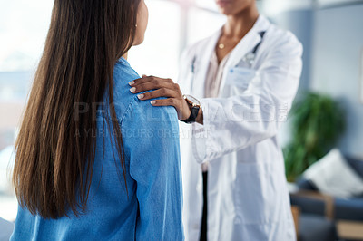 Buy stock photo Cropped shot of a doctor comforting her patient during a consultation