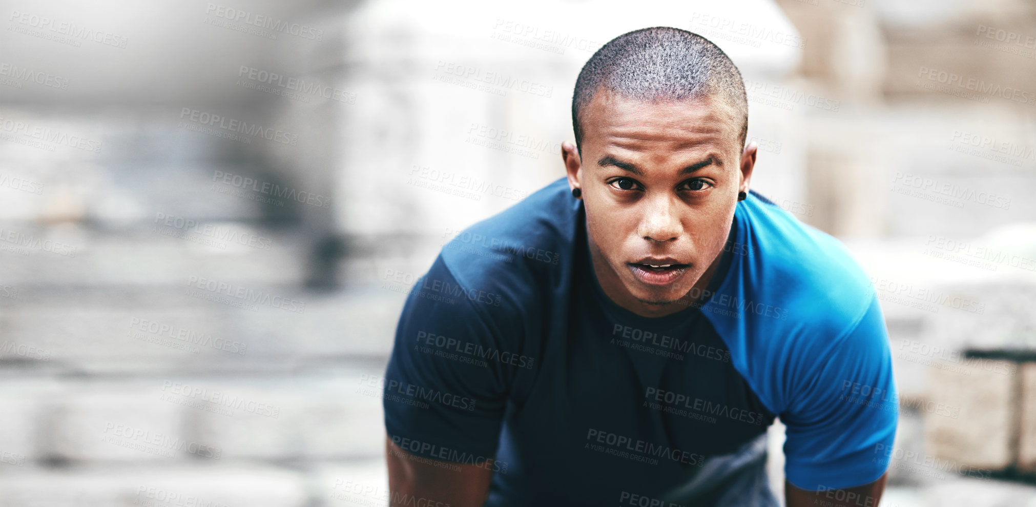 Buy stock photo Portrait of a handsome young sportsman exercising outdoors