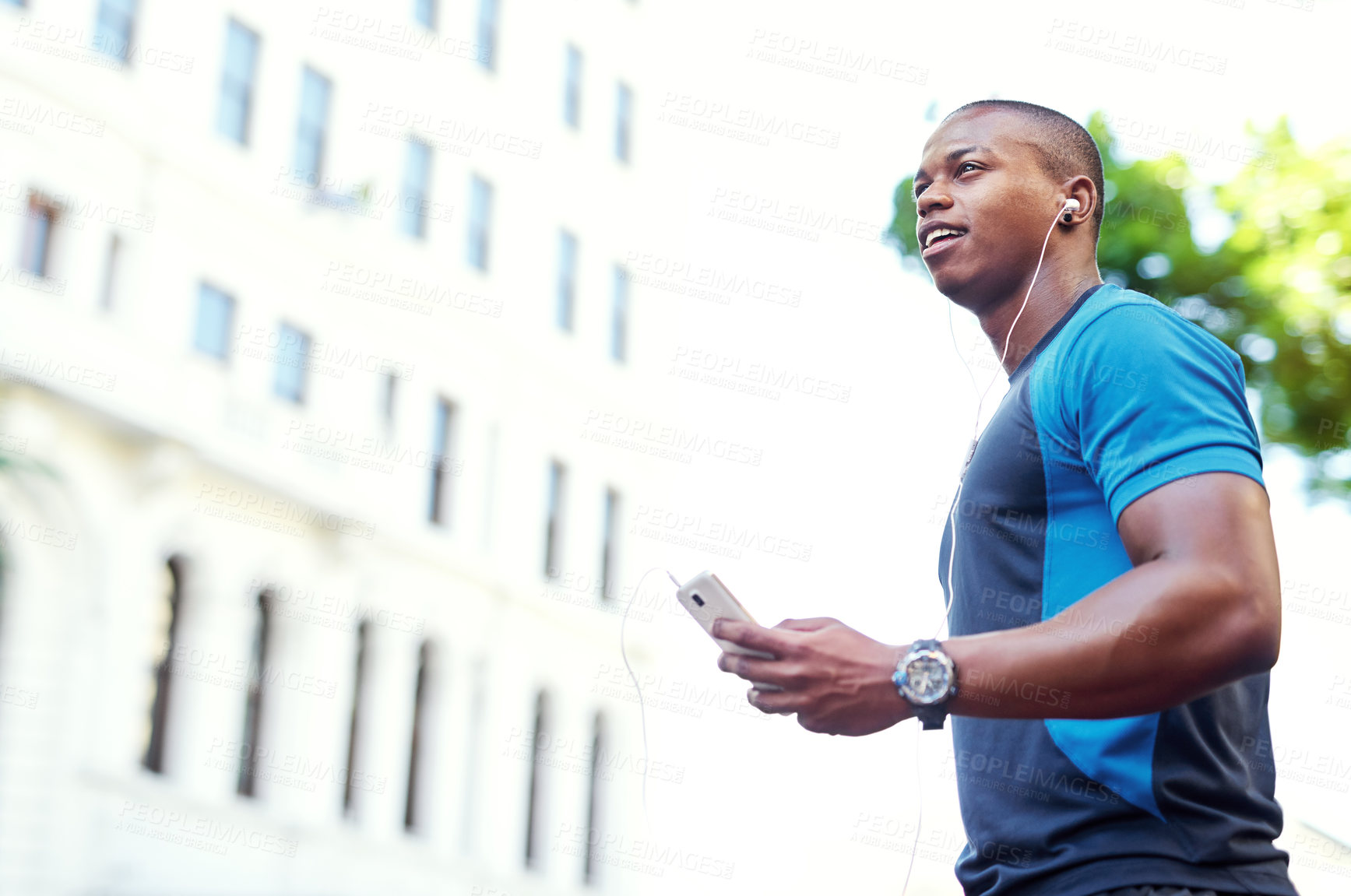 Buy stock photo Fitness, black man and happy with smartphone or earphones for music playlist and screaming service in Atlanta. Audio, outdoor and jogging for training, exercise and workout with entertainment