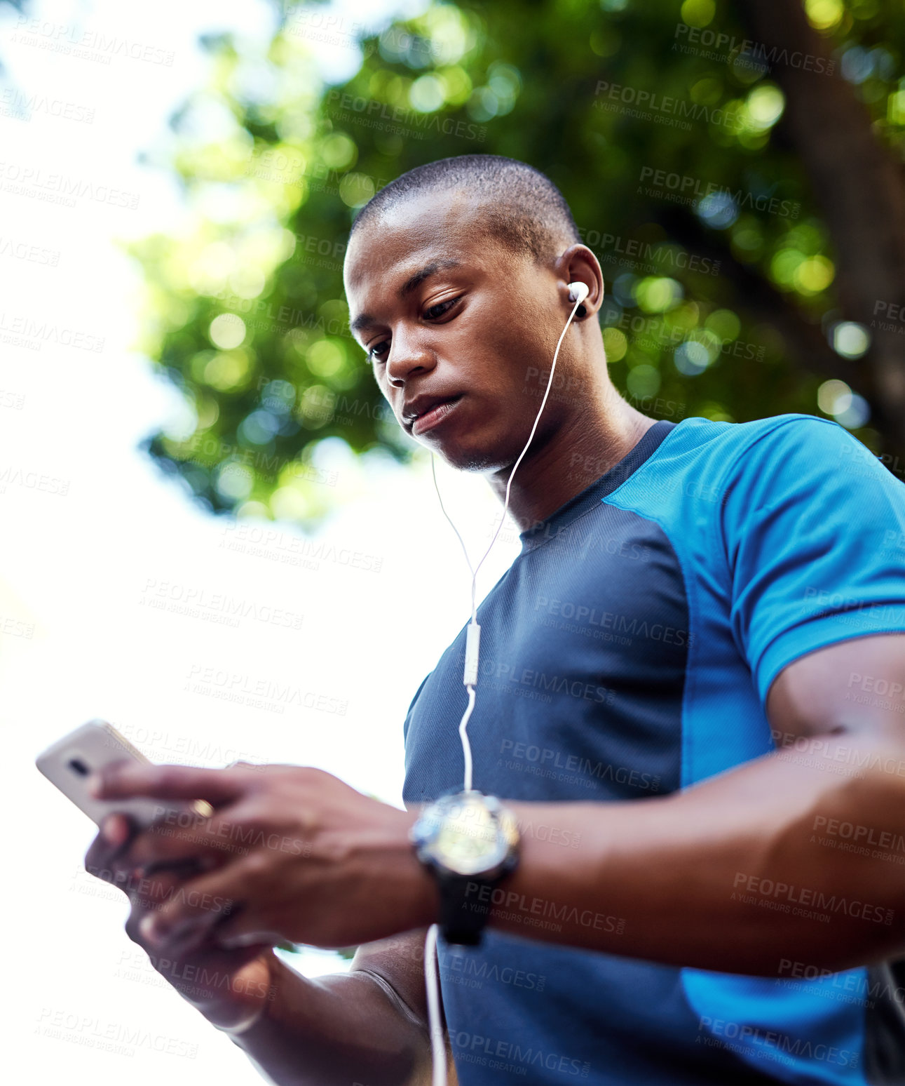 Buy stock photo Exercise, black man and outdoor with smartphone or earphones for music playlist and screaming service in Atlanta. Online, internet and jogging for training, fitness and workout with networking
