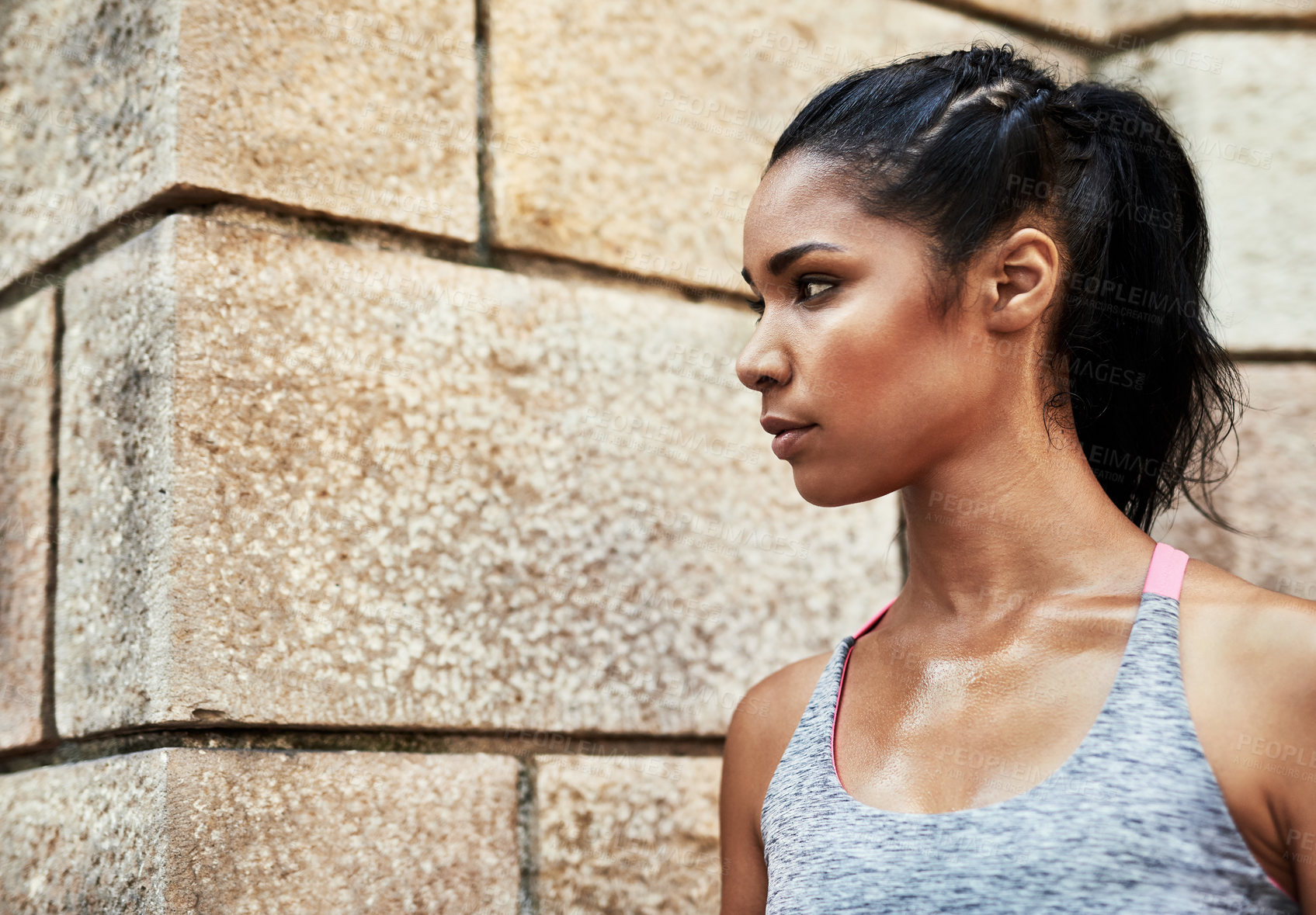 Buy stock photo Shot of an attractive young sportswoman exercising outdoors