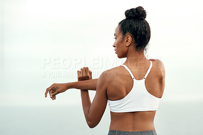 Buy stock photo Woman, arm stretching and outdoor for yoga, workout and training with mockup. Wellness, nature and ocean with female person back doing exercise for health with pilates and relax by sea with stretch