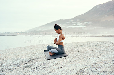 Buy stock photo Yoga, calm meditation and woman on a beach with lotus pose, wellness and fitness. Pilates, sea and female person on sand with peace in nature feeling relax with spiritual and ocean exercise alone