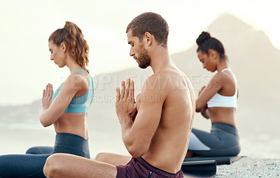 Buy stock photo Fitness, meditation and yoga with people on beach for mental health, peace or wellness in morning. Exercise, training and zen with sporty friends on mat at coast by ocean for balance and mindset