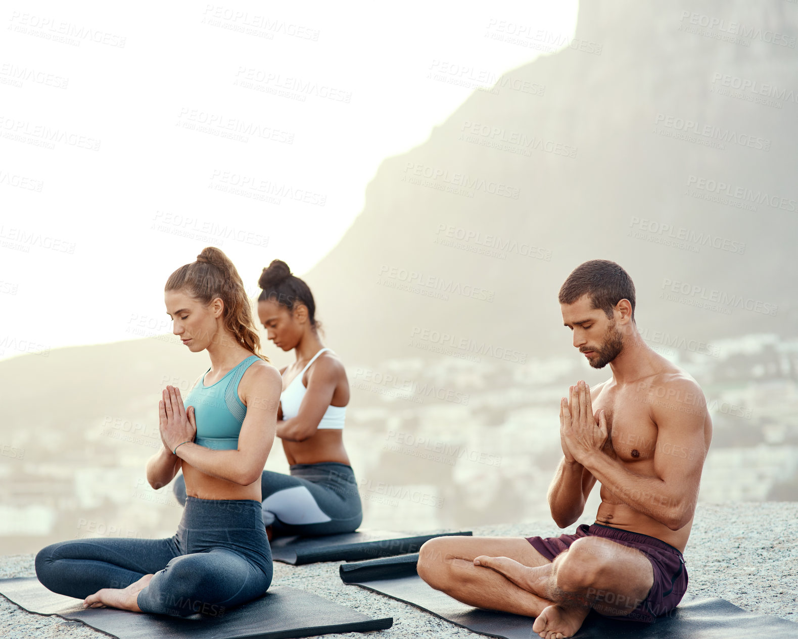 Buy stock photo Exercise, meditation and yoga with friends on beach for mental health, peace or wellness in morning. Fitness, training and zen with sporty people on mat at coast by ocean for balance and mindset