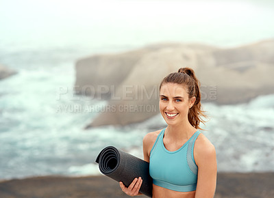 Buy stock photo Portrait, yoga mat or woman ready for beach meditation, wellness and mindfulness in outdoor nature. Happy, smile or confident girl on rock at sea or ocean for awareness or balance in pilates session