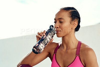 Buy stock photo Fitness, woman and drinking water on break after workout, exercise or training outdoors. Sports, nutrition or thirsty female person in rest with drink, diet or minerals for natural sustainability