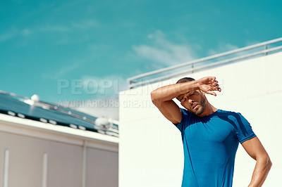 Buy stock photo Sports, fitness and sweat, man with blue sky at outdoor gym for health and wellness with mockup space. Workout, exercise and tired athlete with focus, fatigue and healthy mindset for fit summer goals