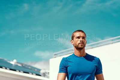 Buy stock photo Cropped shot of a sporty young man standing outside