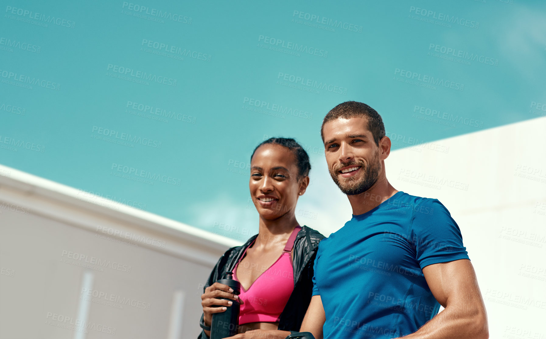 Buy stock photo Fitness, portrait of happy woman and man with blue sky, mockup at outdoor gym for health and wellness in sports. Workout, exercise and personal trainer with athlete, smile and healthy mindset goals.