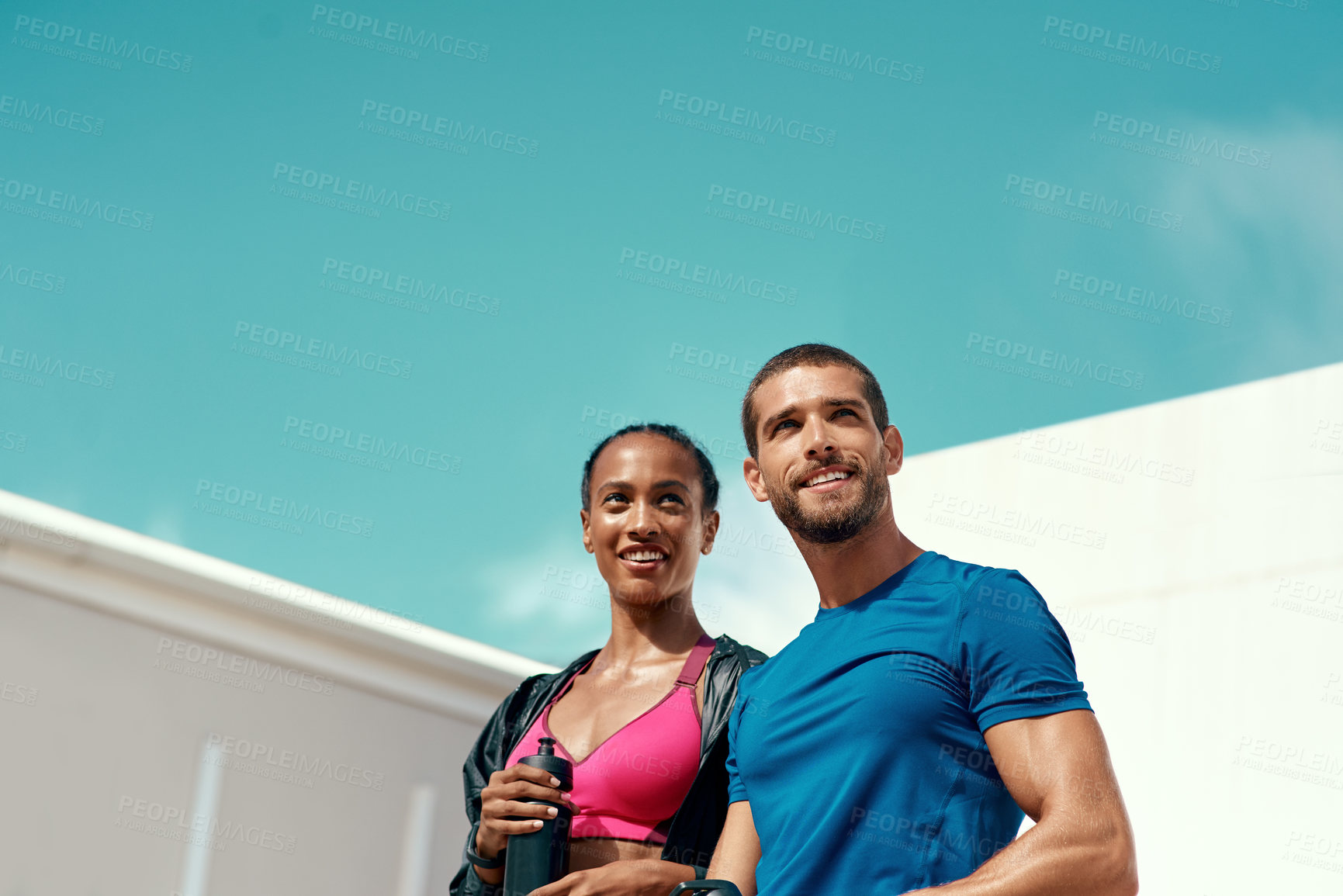 Buy stock photo People, fitness and outdoor in sportswear for exercise, training or workout with blue sky. Personal trainer, man and woman together ready for thinking, gym and physical activity for summer body