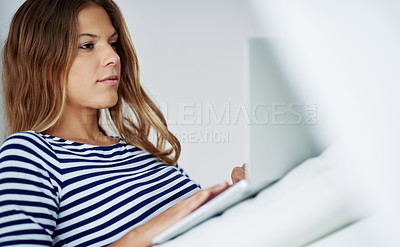 Buy stock photo Typing, laptop and woman in home for freelancing, reading blog or relax on lounge sofa. Hybrid work, computer and online for research, writing email or language translation for social media platform