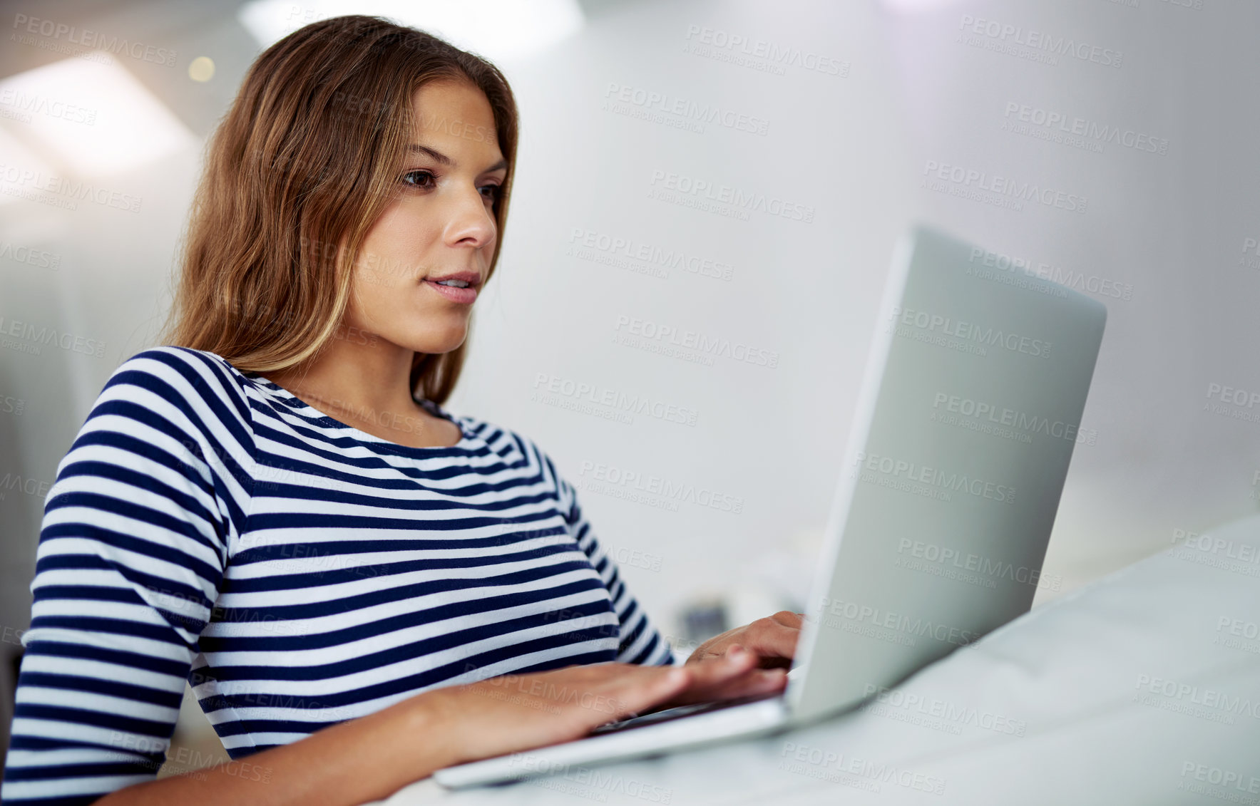 Buy stock photo Typing, laptop and woman in lounge for freelancing, reading blog or relax on home sofa. Hybrid work, computer and online for research, writing email or language translation for social media platform