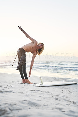 Buy stock photo Body, stretching and fitness man at a beach for surfing, training and morning cardio in nature. Water, sports and male surfer at the ocean for wellness challenge, exercise and vacation hobby in Bali