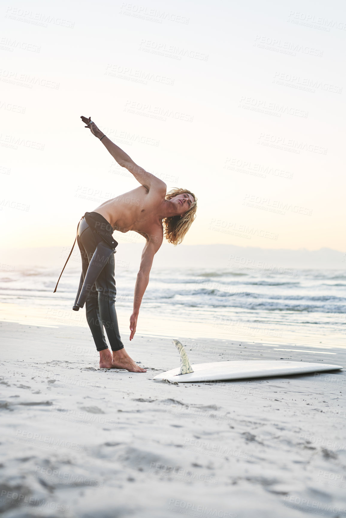 Buy stock photo Body, stretching and fitness man at a beach for surfing, training and morning cardio in nature. Water, sports and male surfer at the ocean for wellness challenge, exercise and vacation hobby in Bali