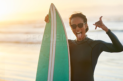 Buy stock photo Portrait of a beautiful young female surfer posing with her surfboard at the beach