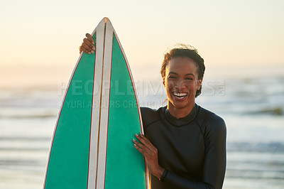 Buy stock photo Portrait of a beautiful young female surfer posing next to her surfboard at the beach
