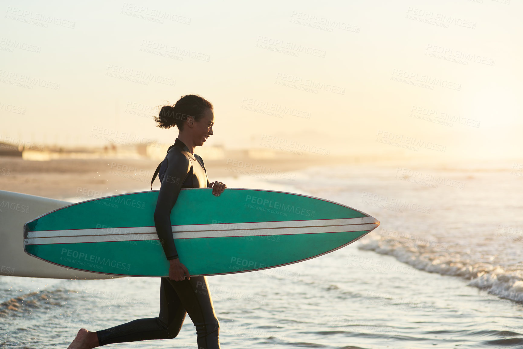 Buy stock photo Running, surfboard and woman at beach for fitness, exercise and wellness in summer. Sunset, athlete and happiness for workout or sports in nature with adventure, ocean and cardio in California