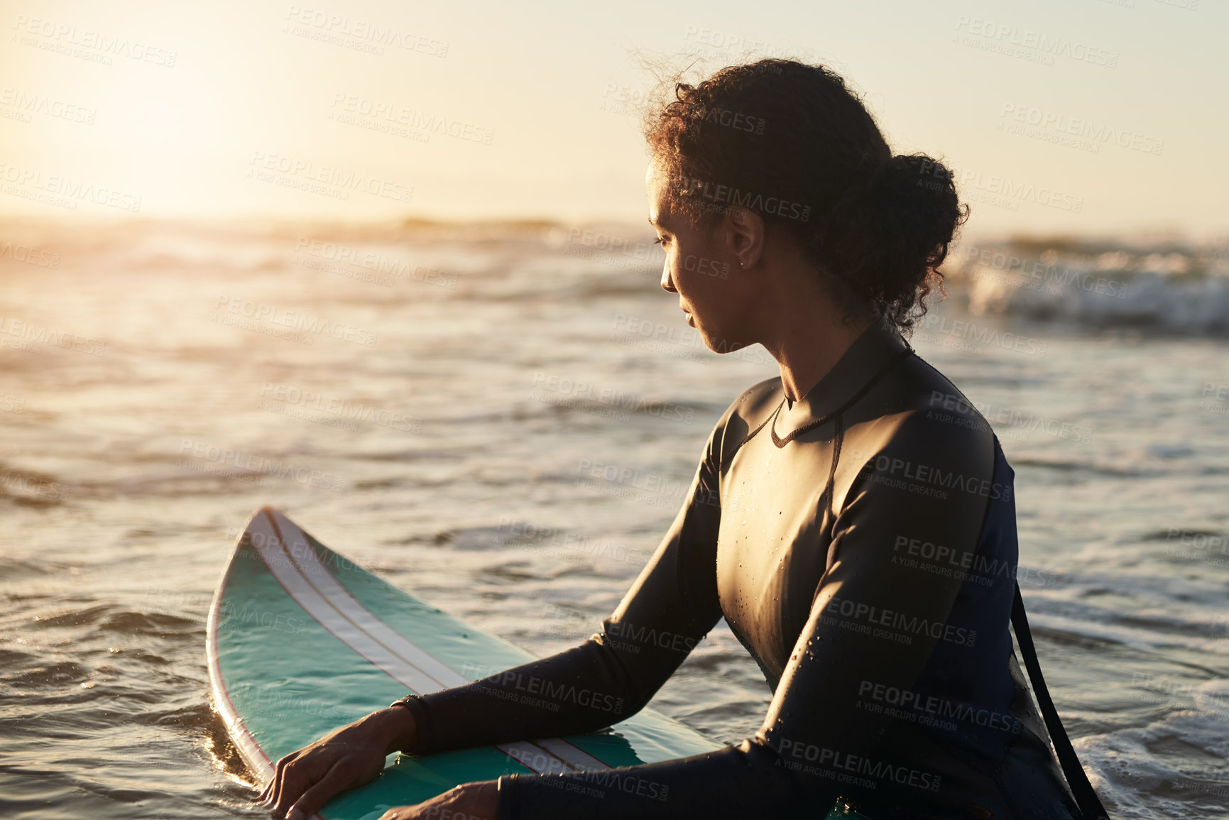 Buy stock photo Shot of a beautiful young woman surfing in the ocean