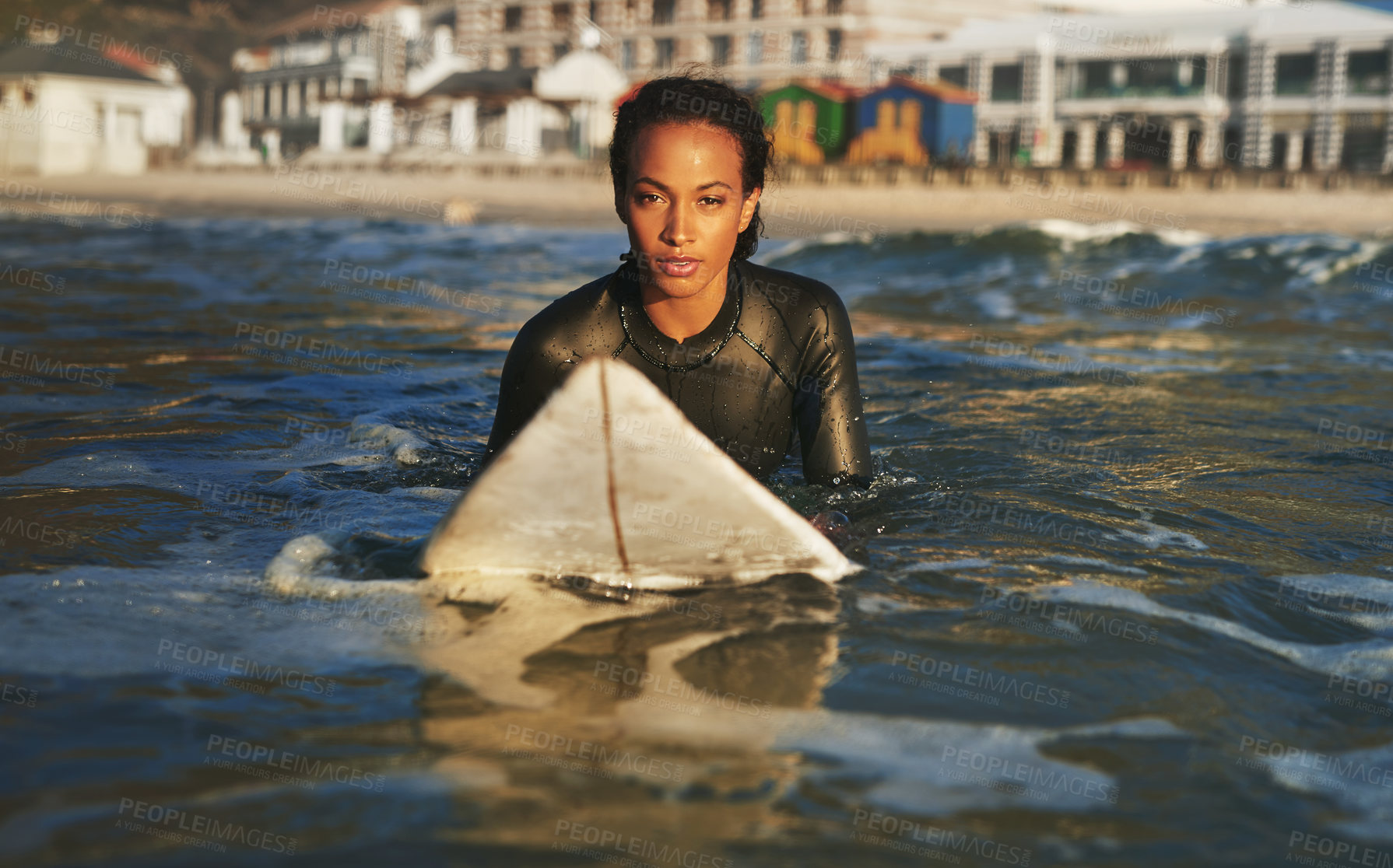 Buy stock photo Portrait, woman and swimming or surfing in ocean for summer adventure, water hobby and fun. Surfer girl, sport and board floating at sea with tropical vacation, exercise and practice for competition